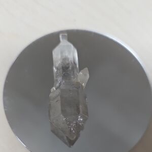 Elegant Quartz Crystal on Reflective Base
